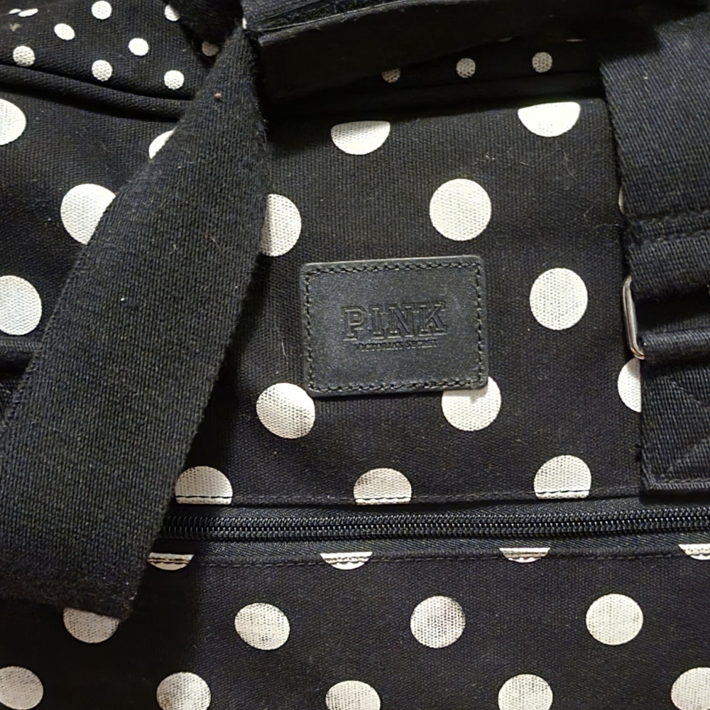 Pink duffle and suitcase
